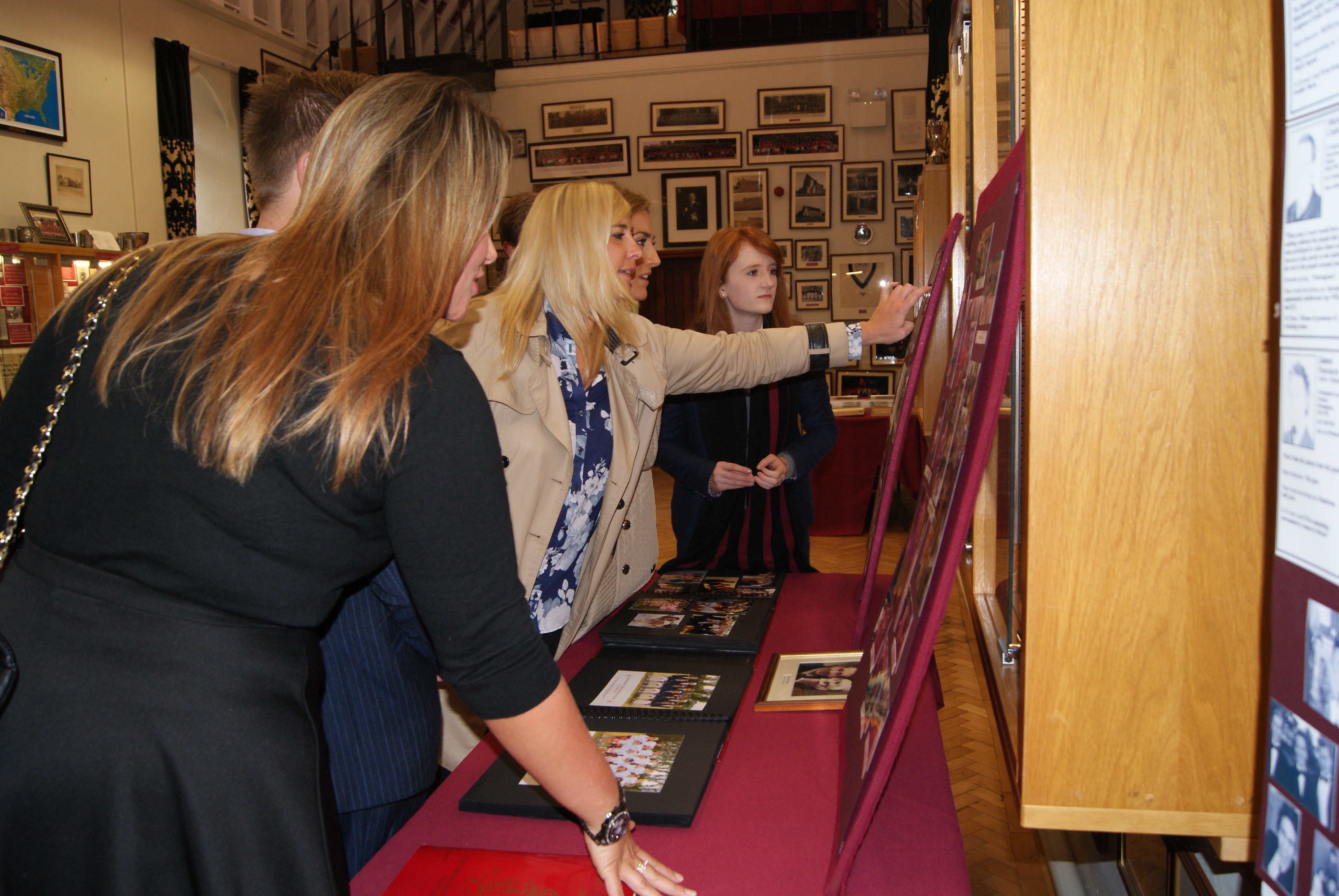 2005 Leavers' Reunion, 3/10/2015 - OBs looking at their House photos in the Old Chapel